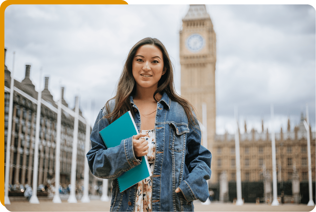 Woman holding book near Big Ben